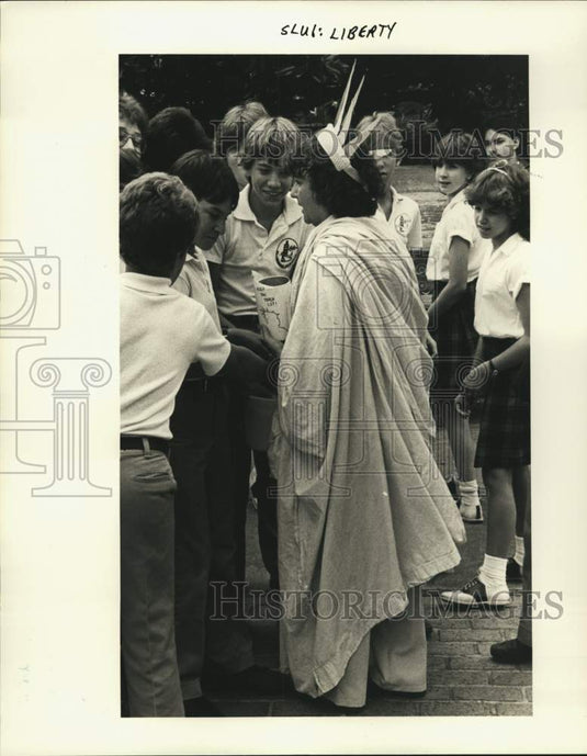 1985 St. Lawrence School teacher Sandy Landry as "Statue of Liberty" - Historic Images