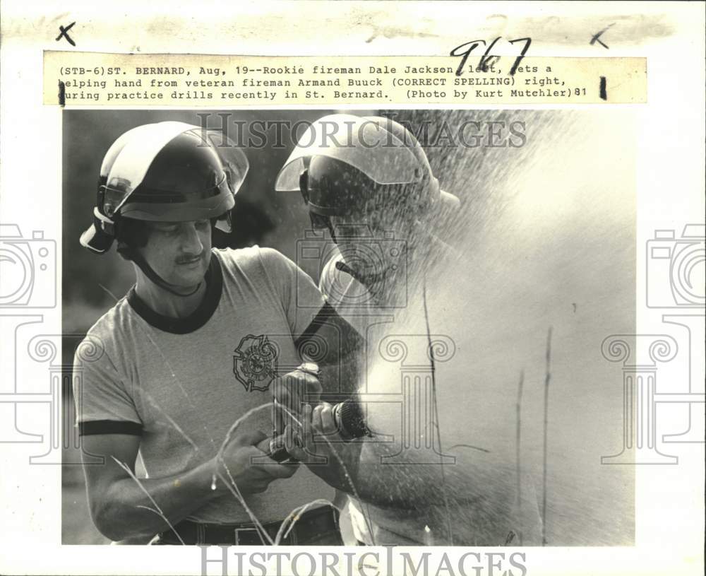 1981 Rookie fireman Dale Jackson at practice drills in St. Bernard. - Historic Images