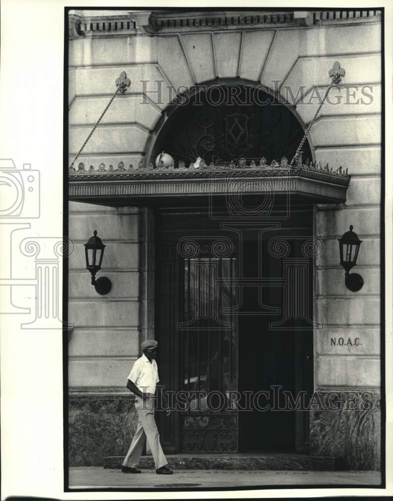 1984 Man walks past New Orleans Athletic Club at 222 North Rampart - Historic Images