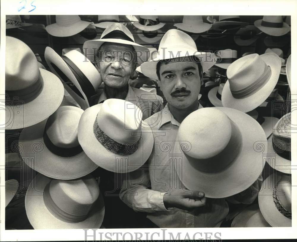 1986 Men surrounded by Panama hats at New Orleans Hat Company - Historic Images