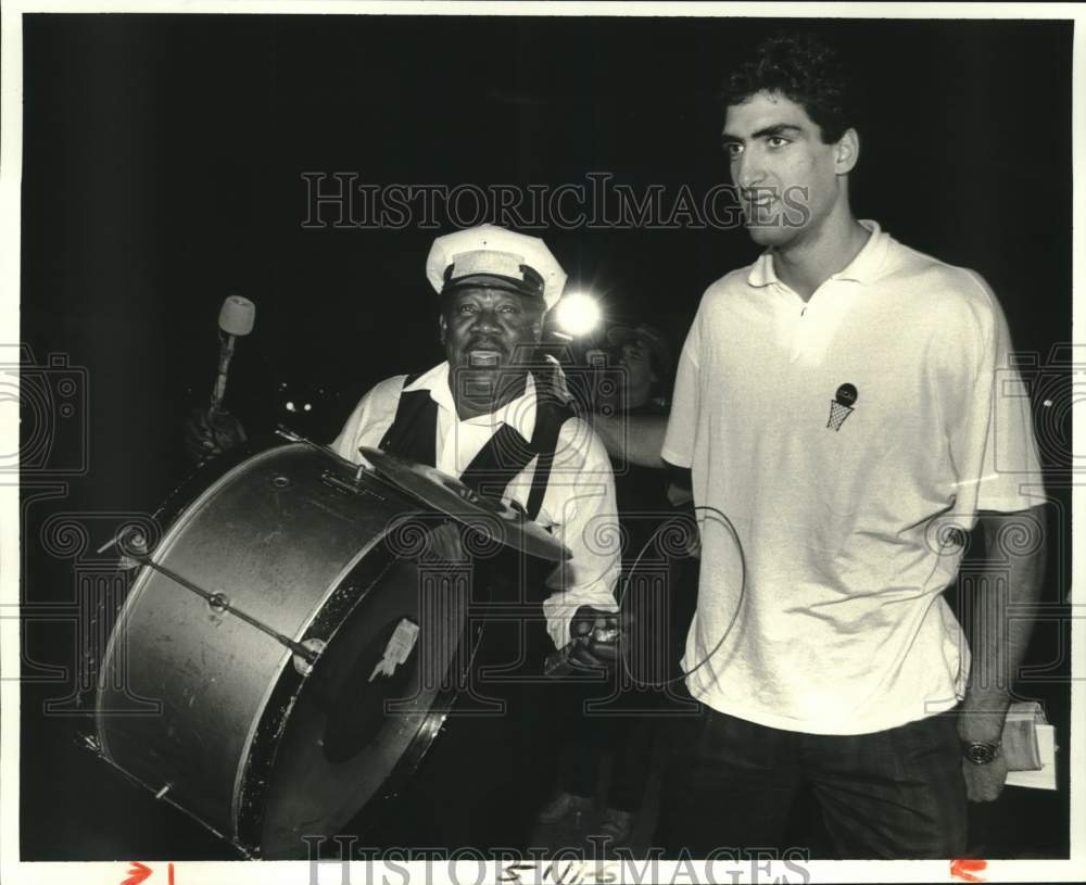 1987 New Orleans Jazz Band greet Rony Seikaly at New Orleans Airport - Historic Images