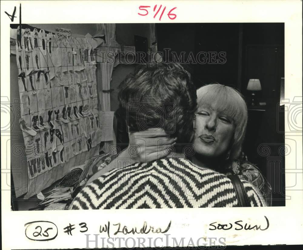 1985 Zandra Rhodes gives model an after-the-show hug. - Historic Images