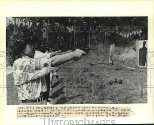 1989 Gina McKinzie fires her revolver at Camp Villere pistol range - Historic Images