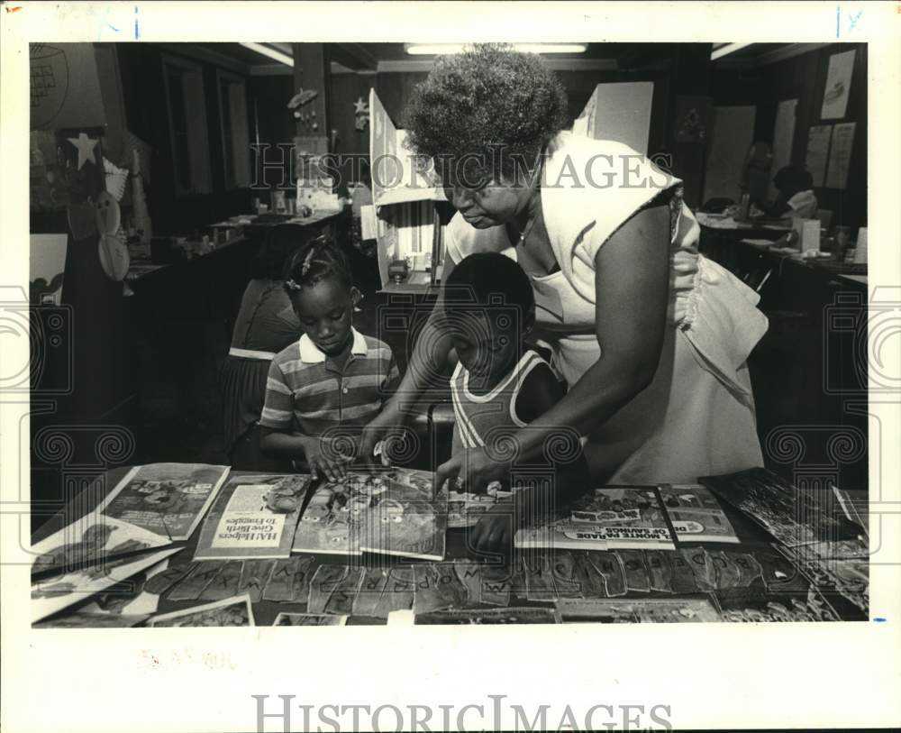 1983 St. Mark&#39;s Day Care trainee Ursula Price working with children - Historic Images