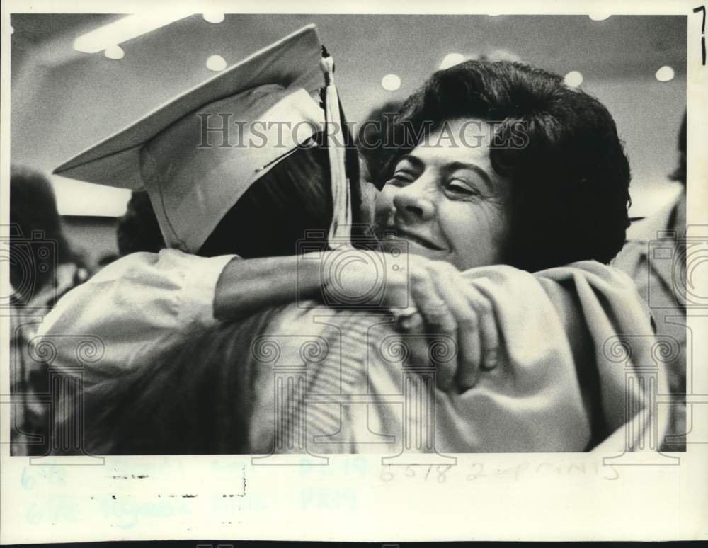 1982 Jerri Lynn Stafford congratulated by stepmother on graduation - Historic Images