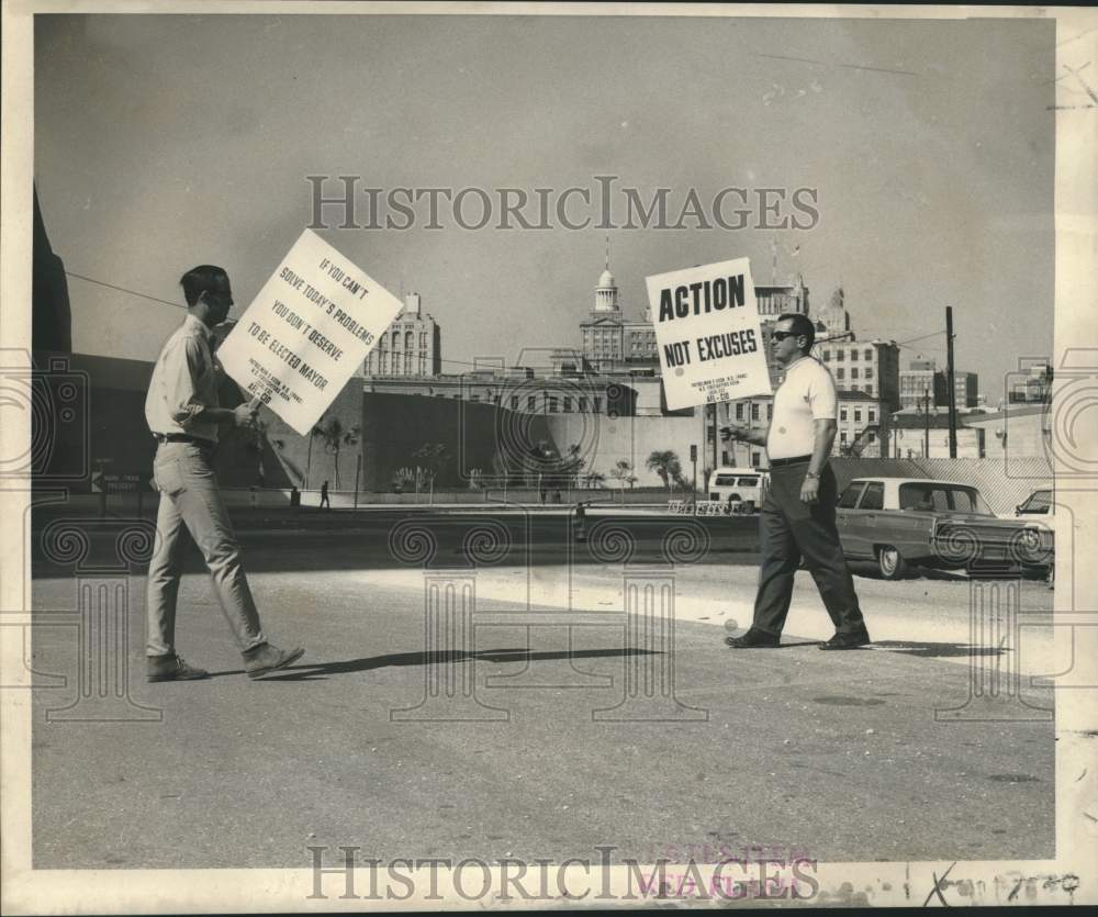 1969 Police and firemen pickets march along riverfront. - Historic Images