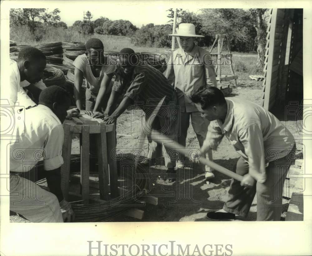 1971 African Men and Chinese Supervisor Work on Railroad, Zambia - Historic Images