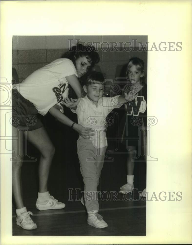 1989 Jill Sevin teaches cheerleading in a clinic in Kenner. - Historic Images