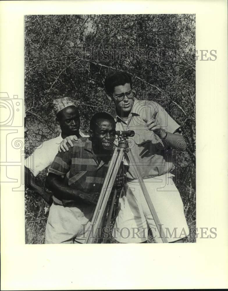 1986 Gene Schreiber, Peace Corps Volunteer, With Two Men Surveying - Historic Images