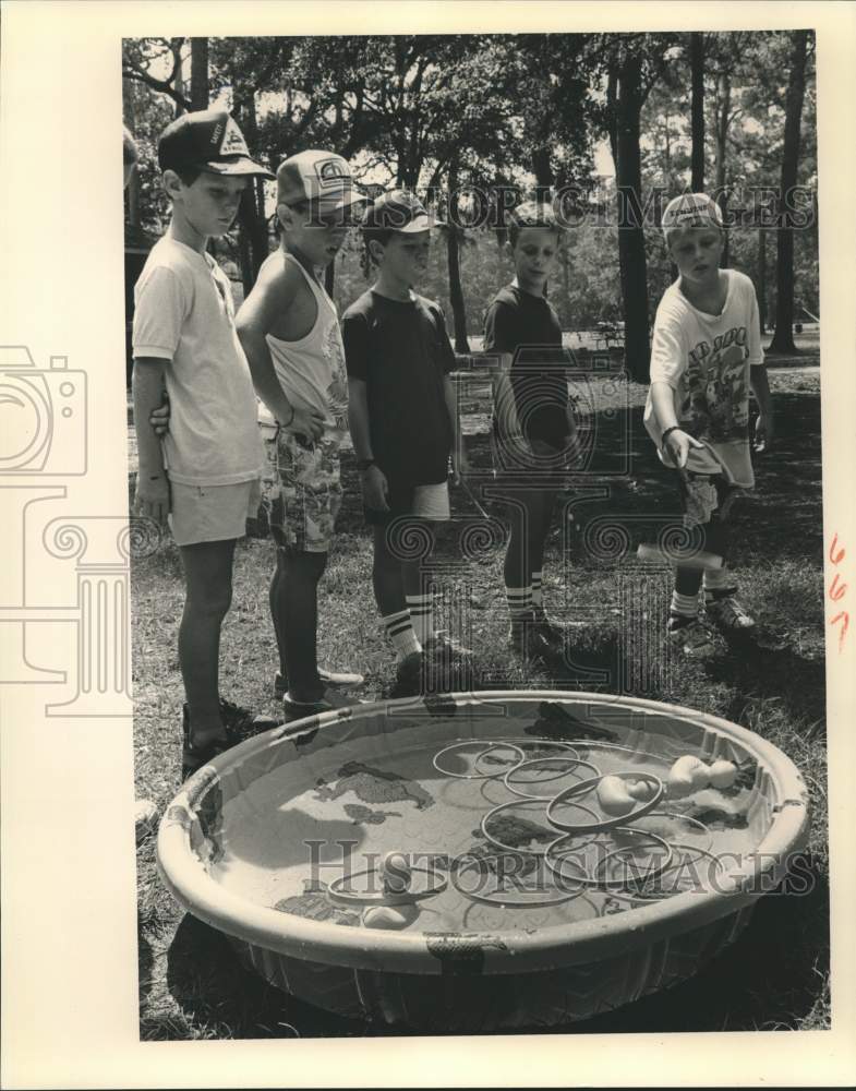 1988 Metairie YMCA Day Campers play Ring Toss at Fun Fest - Historic Images