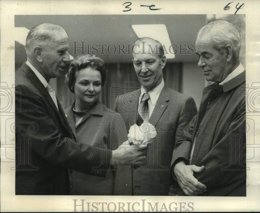 1971 Gulf Coast Camellia Society's chairman holds winning bloom - Historic Images