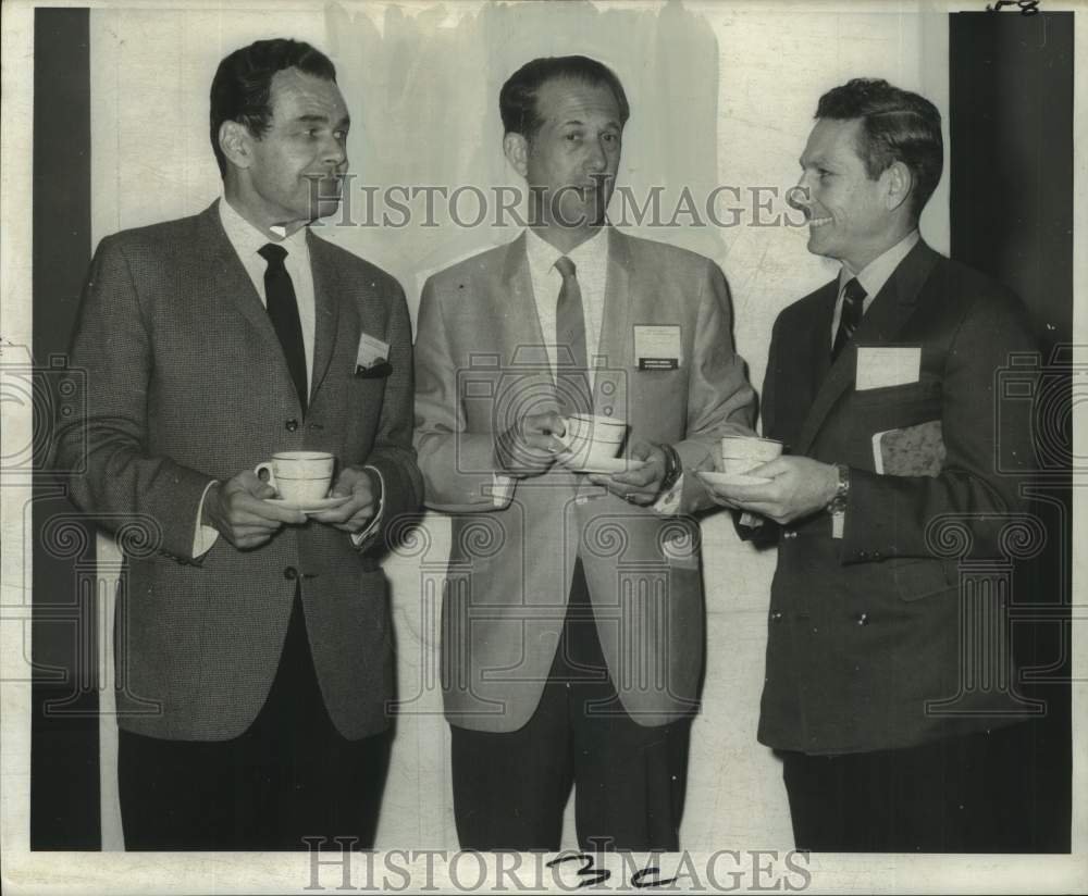 1969 Dr. William Wright and other surgeons discuss nose surgery - Historic Images