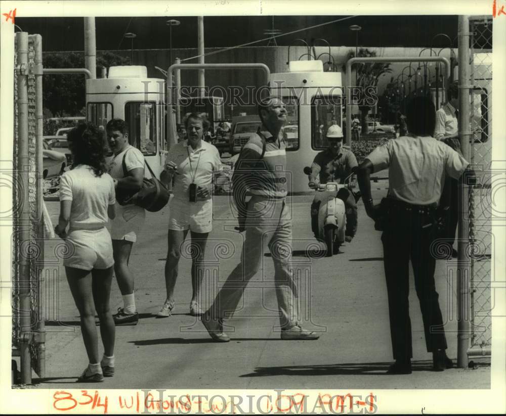 1984 Passers-byers at Louisiana World&#39;s Fair main gate. - Historic Images