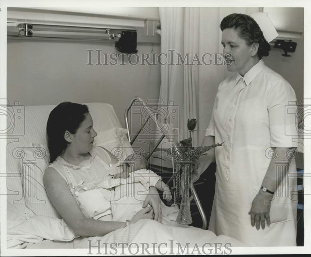 1968 Gladys Walker, RN presents Mother&#39;s Day greeting to Mrs. Riguad - Historic Images