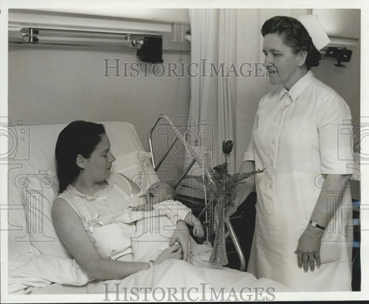 1968 Gladys Walker, RN presents Mother's Day greeting to Mrs. Riguad - Historic Images