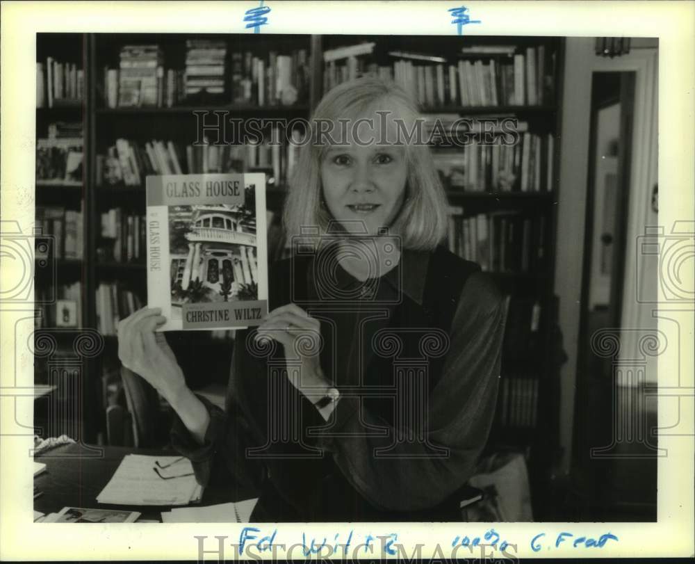 1994 Author Christine Wiltz holds her new book &quot;Glass House&quot; - Historic Images