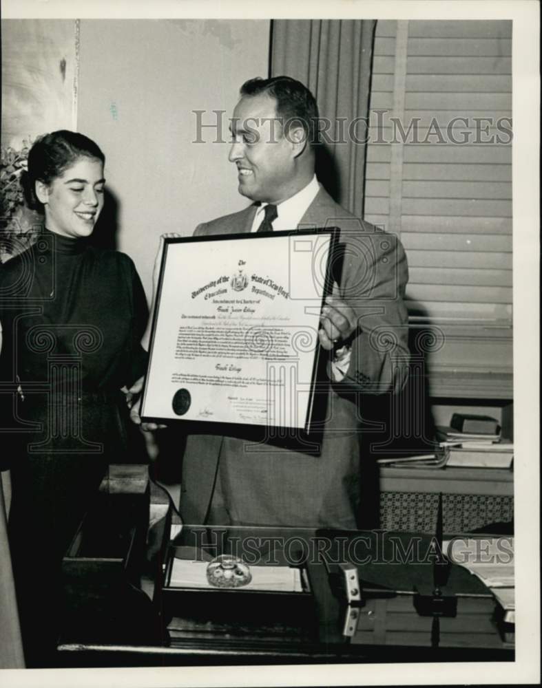 1952 Lynn Janet Wohl examines Finch charter with Roland De Marco-Historic Images