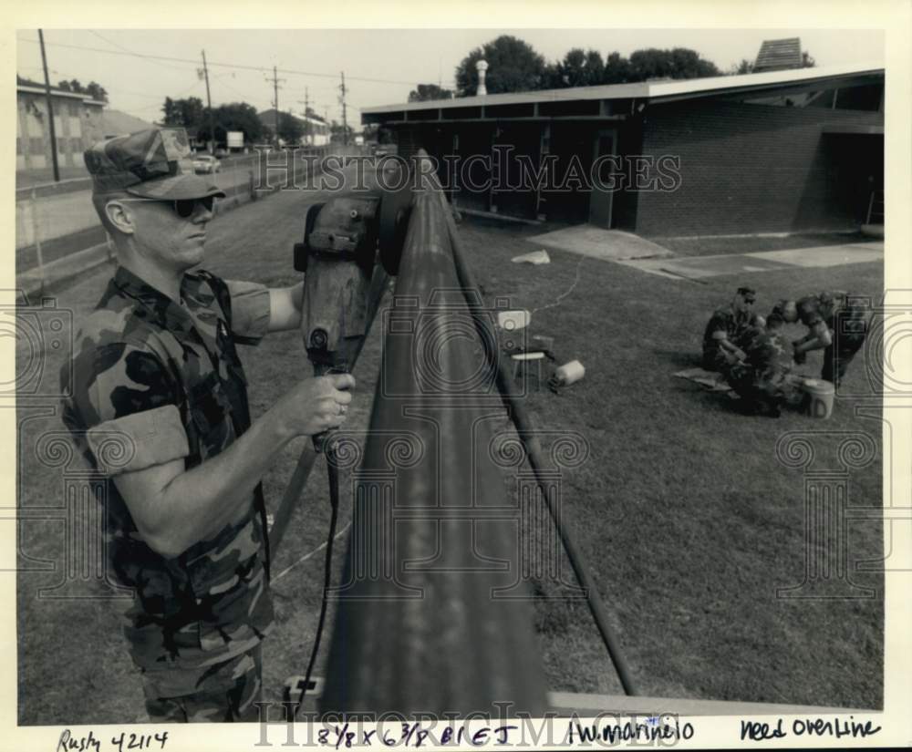 1992 Corporal Scott Henderson takes rust off swing at G.T. Woods - Historic Images