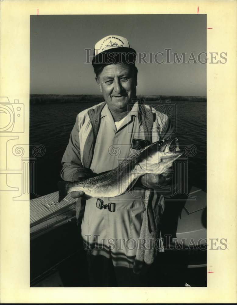 Press Photo Fisherman displays winter specks fish - noc50472 - Historic Images