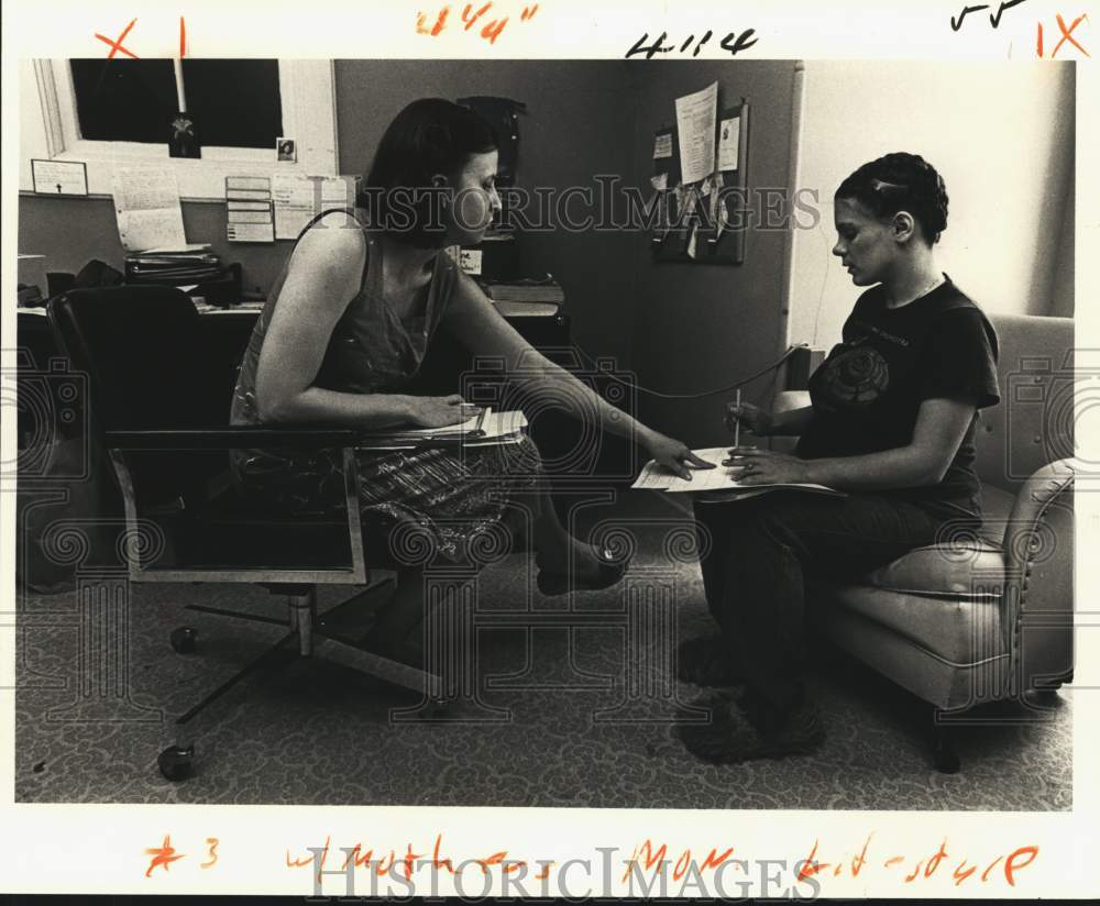 1980 Counselor Victoria Sherrouse talks with 16-year-old Kelly. - Historic Images