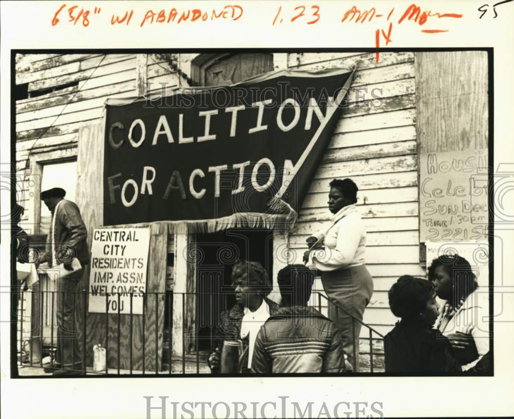 1981 Carolyn Whitfield outside abandoned house to be renovated - Historic Images