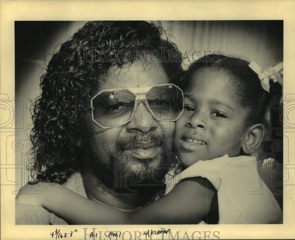 1990 Glastus White gets hug from granddaughter MaKesha outside court - Historic Images