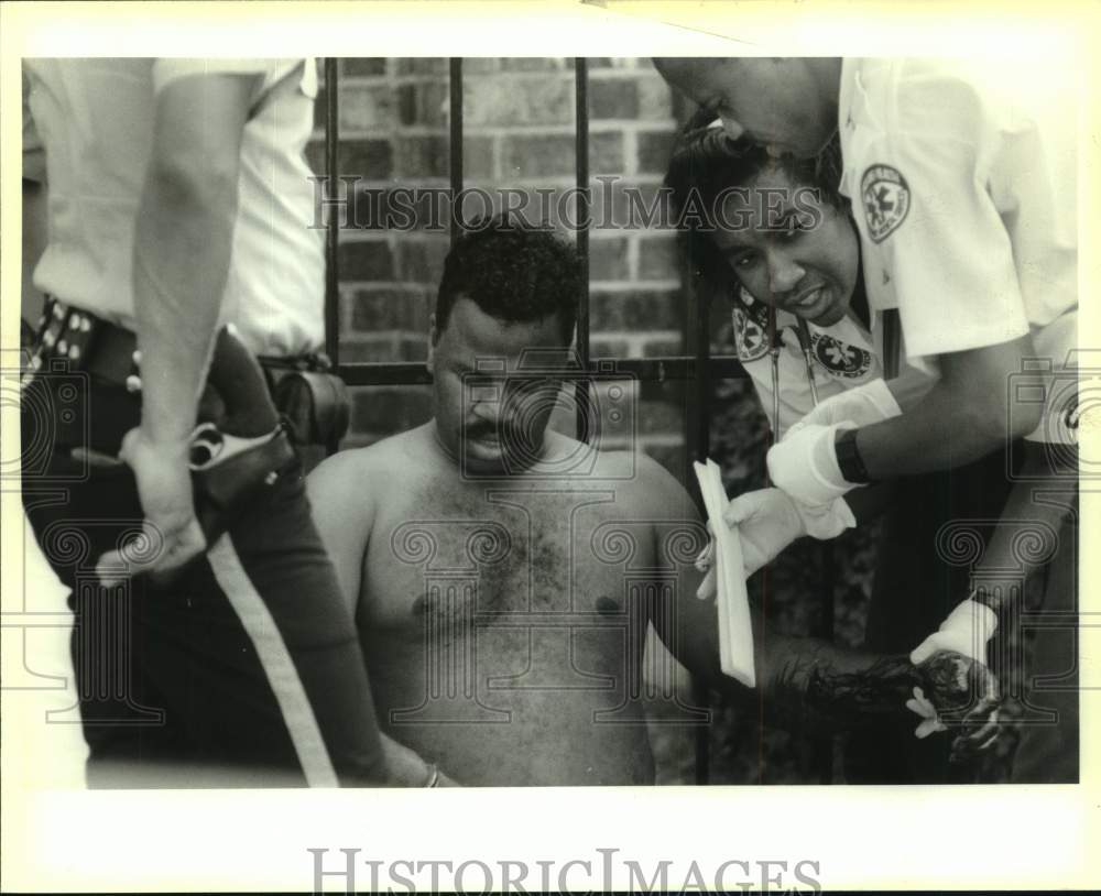 1992 New Orleans Police Officer with EMTs and Gunshot Victim - Historic Images