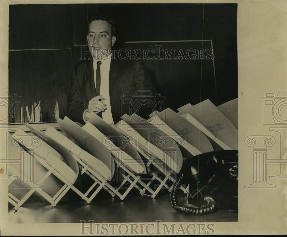 1965 Charles Ward views his documents in expanding file-Historic Images