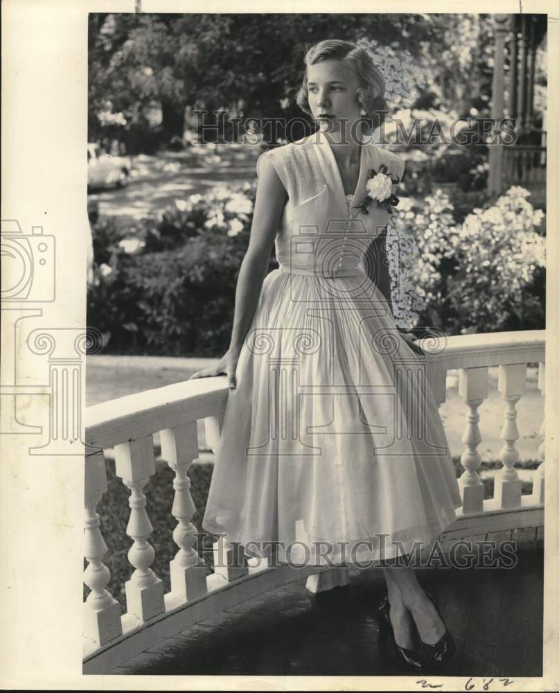 1959 Constance Shanes wearing a tea-length gown &amp; corsage - Historic Images