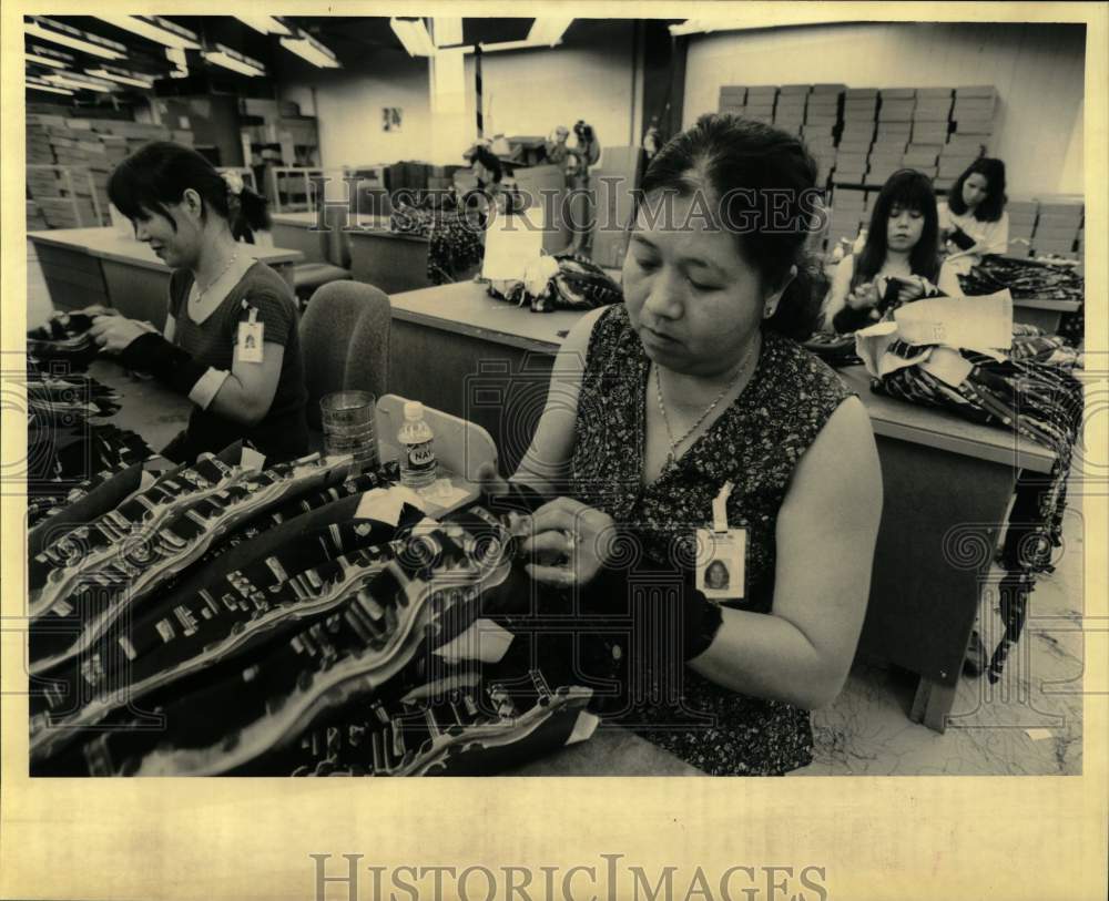 1995 Piecing ties, folding and tucking on a Wemco line - Historic Images