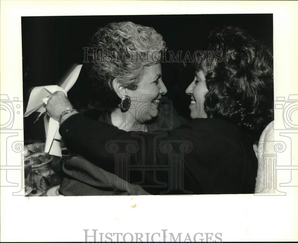 1995 Small Business Champ Billie Simoneaux gets hug from Lily Acosta - Historic Images