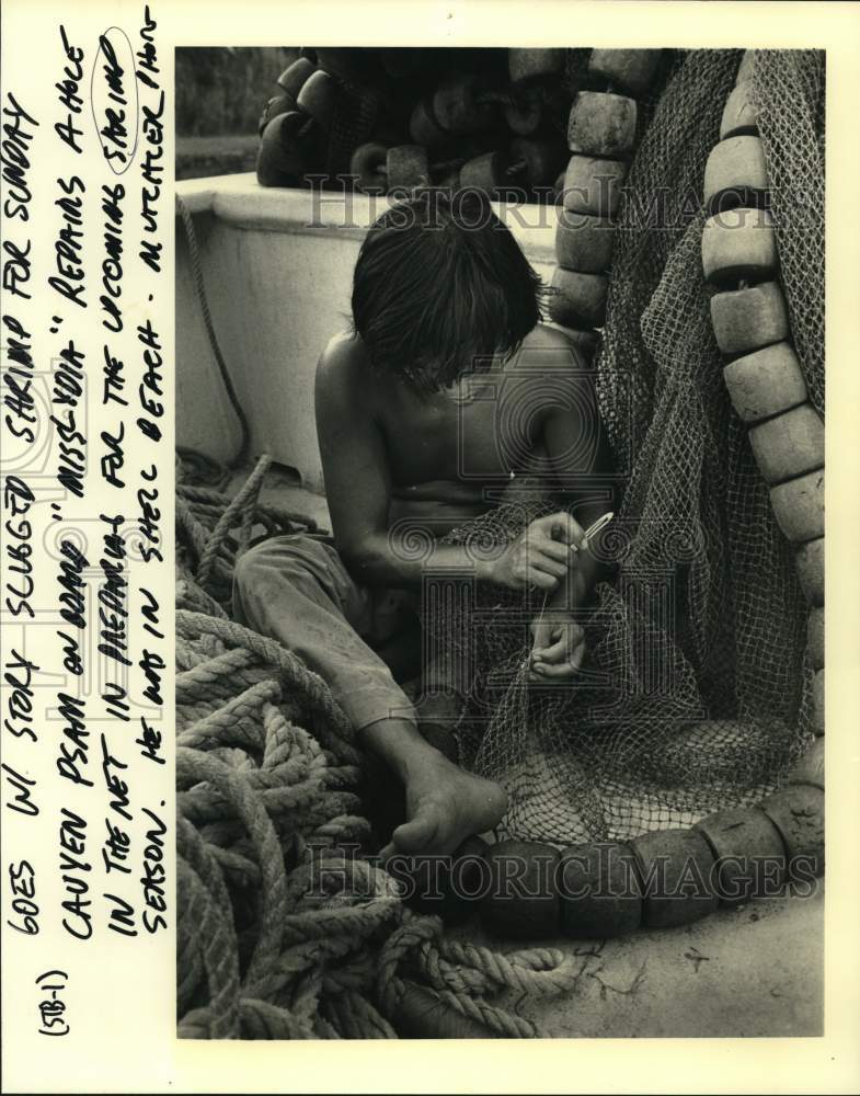 1987 Cauyen Psam on board "Miss Lydia" repairs net for shrimp season - Historic Images