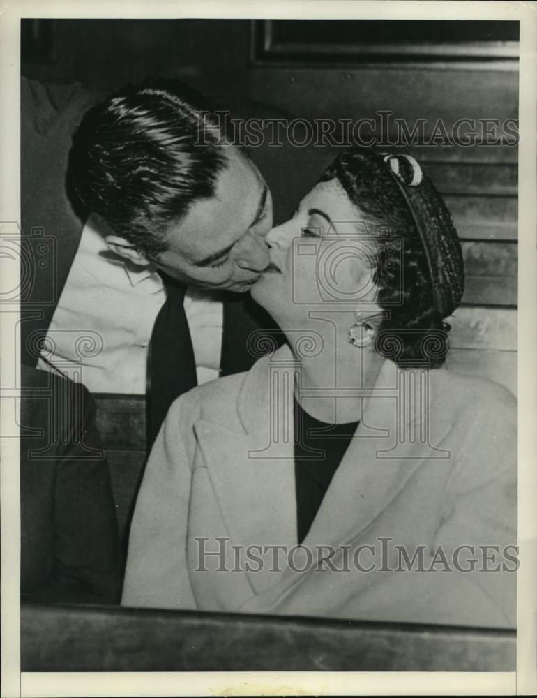 1954 Louis Shoulders, convicted former police lieutenant kisses wife - Historic Images