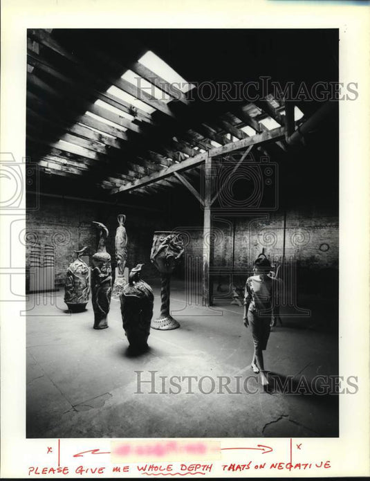 1989 Simms Fine Arts' Suzanne Farnsworth in art storage area - Historic Images