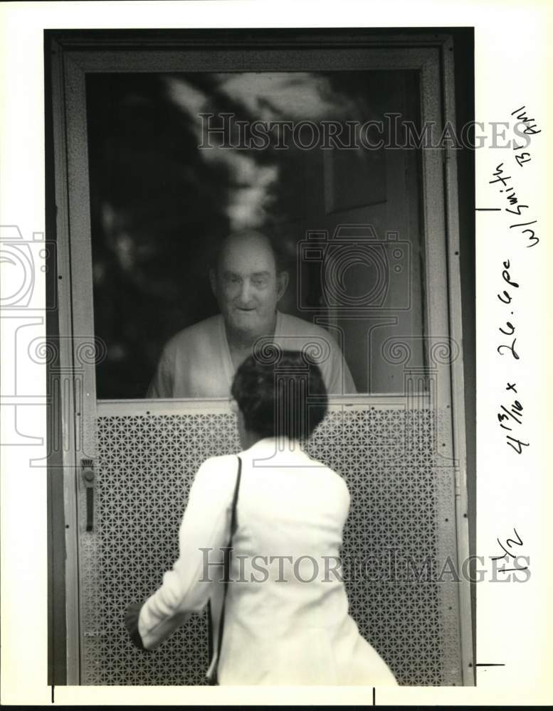 1990 Edward Knight greets Mary Smith of the Council on Aging - Historic Images