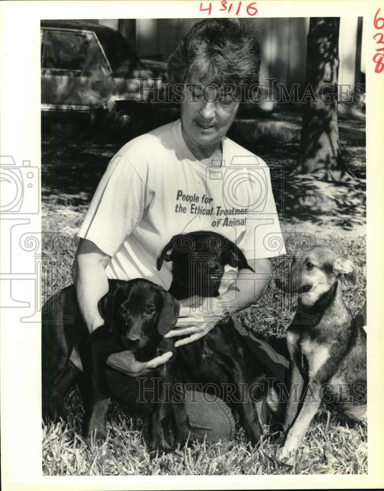 1988 Mary Jo Revette with dogs for adoption at Slidell Community - Historic Images