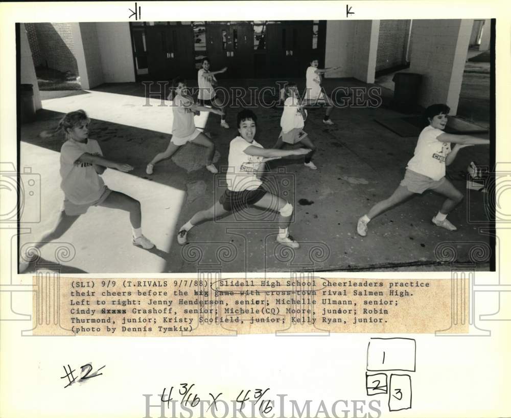 1988 Slidell High School cheerleaders practice before the game - Historic Images