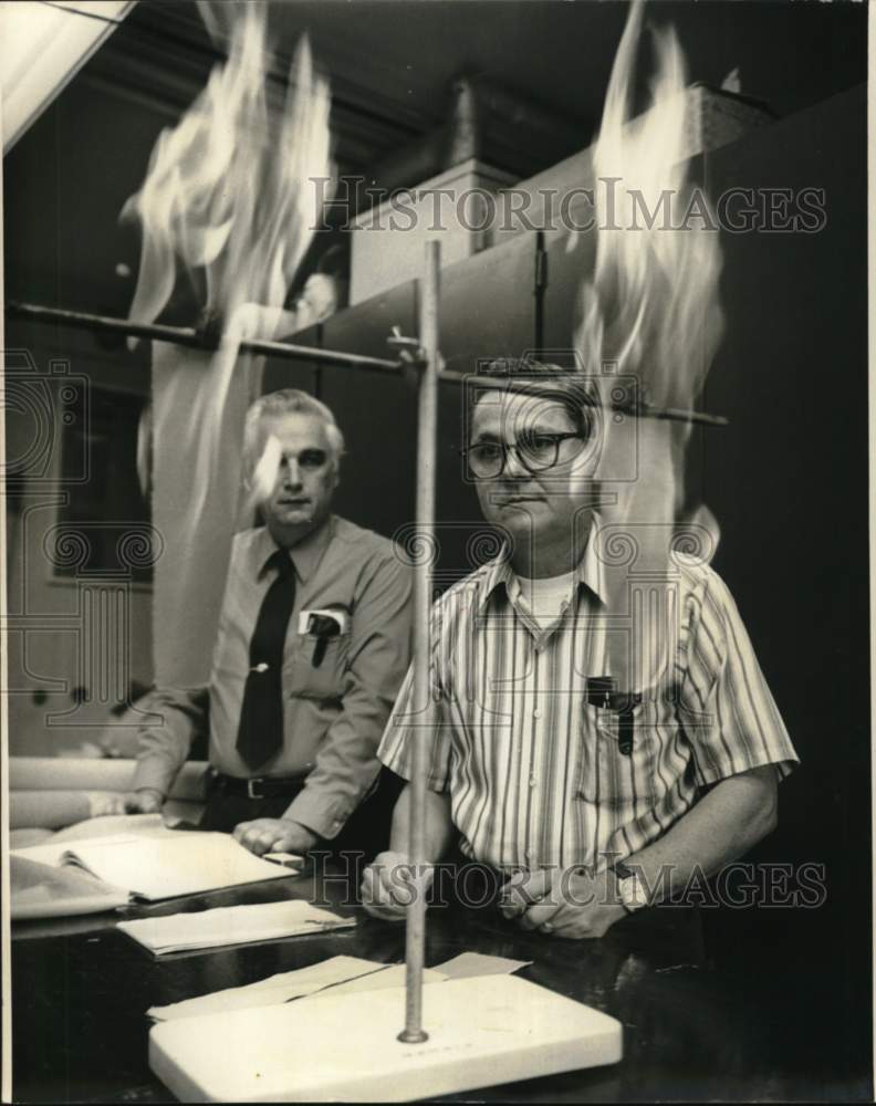 1974 George L. Drake Jr. & John Beninate conduct flammability test - Historic Images