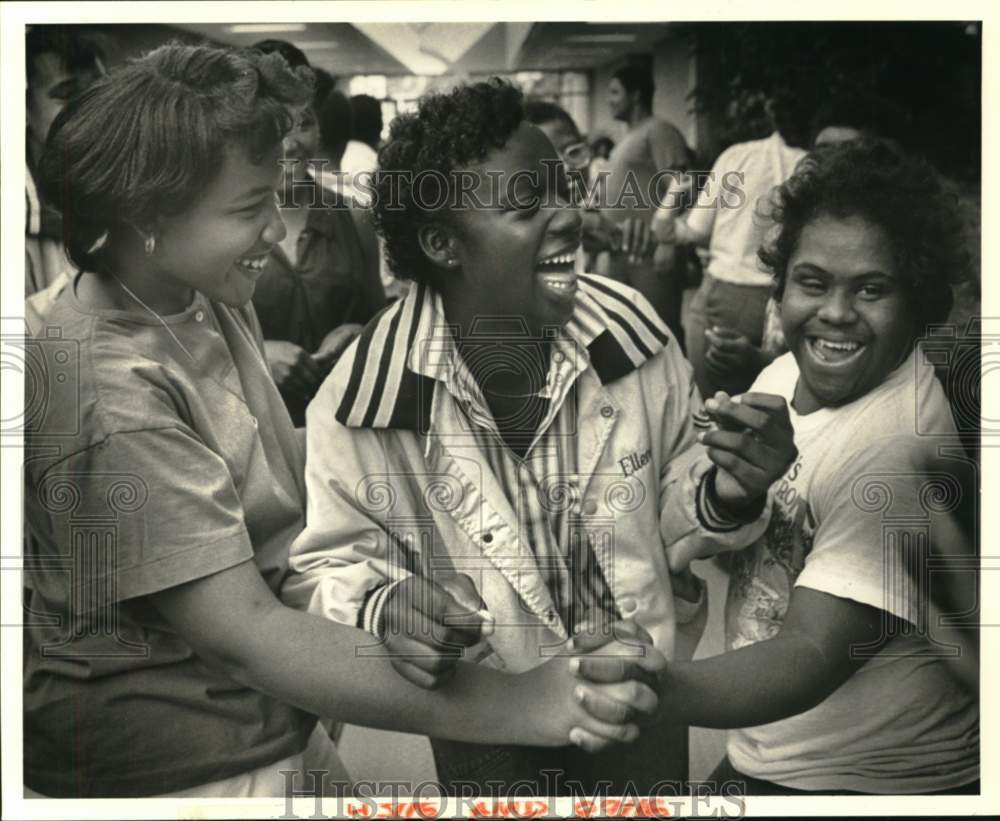 1988 Special Students gather in the hallway at school - Historic Images