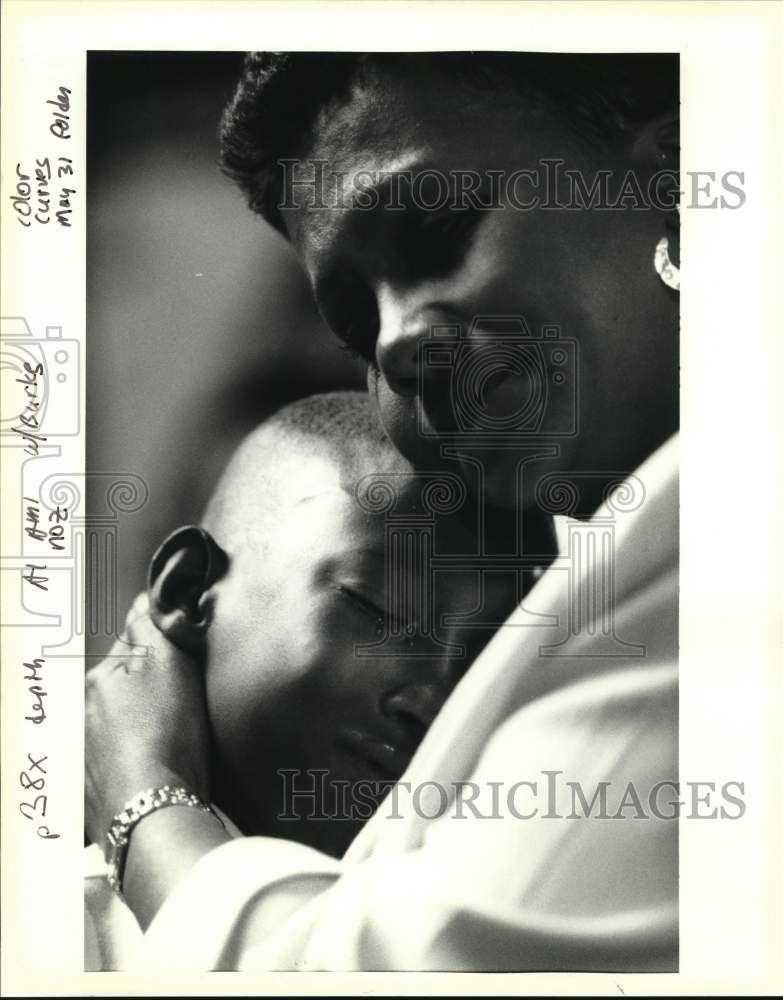 1994 Rodrick Smith comforted by Carmel Mire- Laurel Elementary - Historic Images