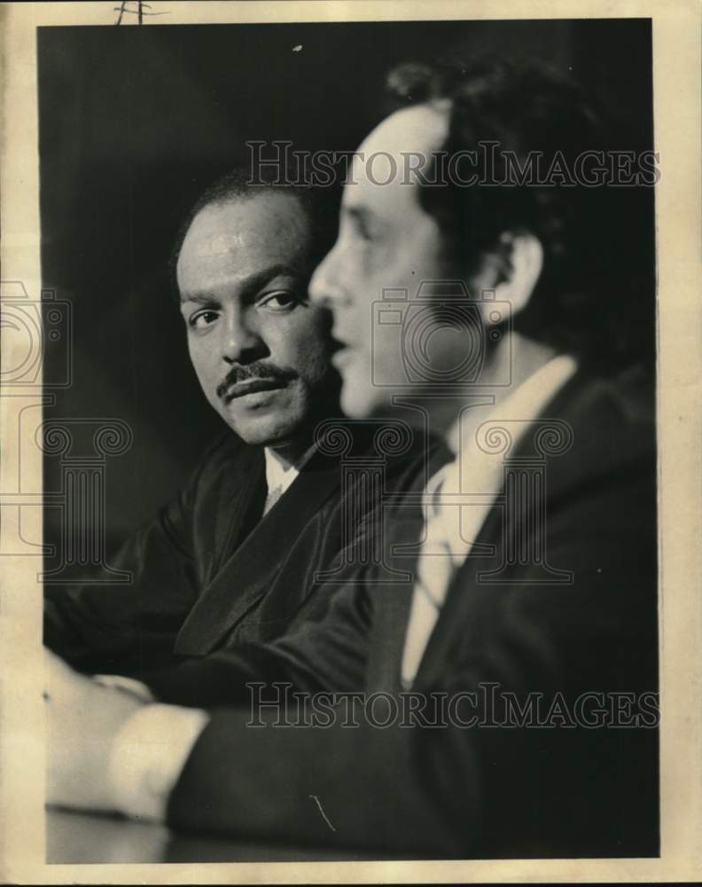 1973 Press Photo Mayor Carl Stokes, left, looks at man speaking - Historic Images