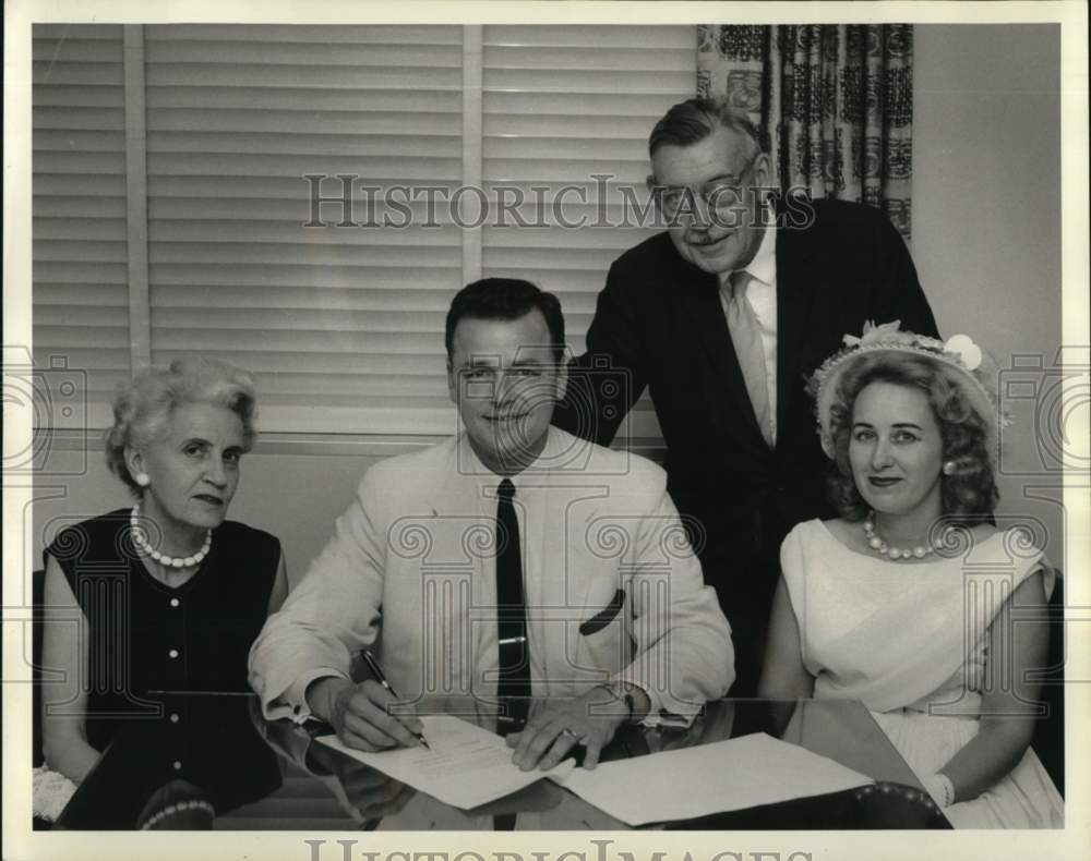 1963 James Spencer with JUNO officers sign Lowich Building contract - Historic Images