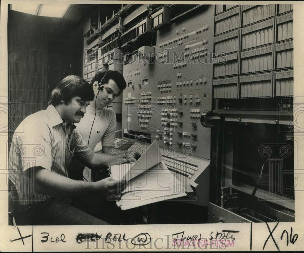 1974 South Central Bell technicians check circuit blueprints - Historic Images