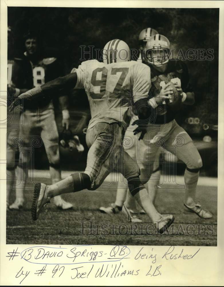 1980 Press Photo #13 David Spriggs rushed by #97 Joel Williams in football game - Historic Images