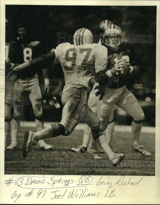 1980 Press Photo #13 David Spriggs rushed by #97 Joel Williams in football game