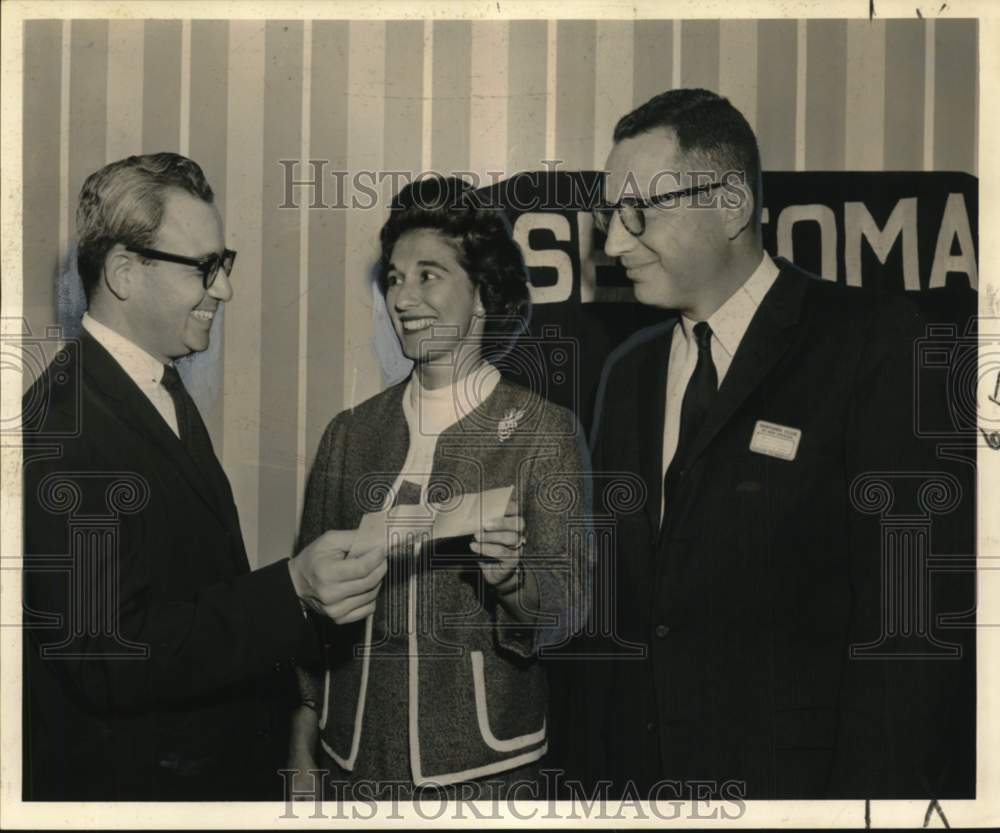 1961 Mrs. Gene Usdin, of Project Learn, receives a check. - Historic Images