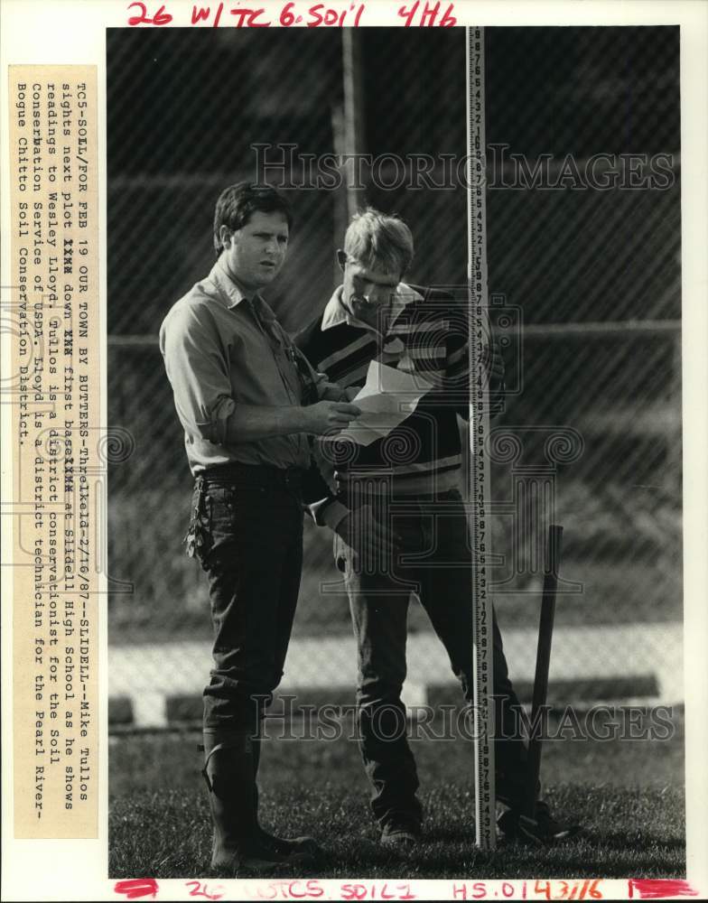 1987 Mike Tullos, district conservationist with Welsey Lloyd - Historic Images