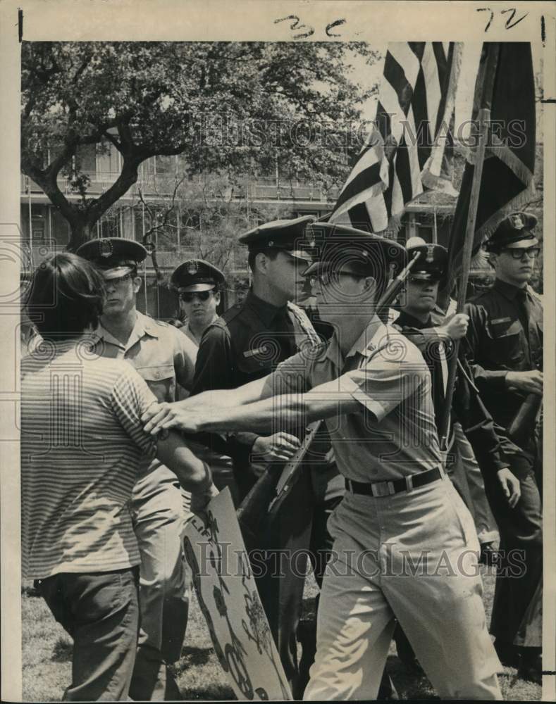 1969 A demonstrator protesting the Vietnam War at the Tulane campus - Historic Images