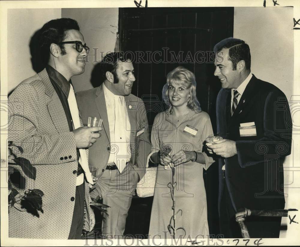 1972 Mrs. William Camara, Ralf Saulnier with a couple during party - Historic Images