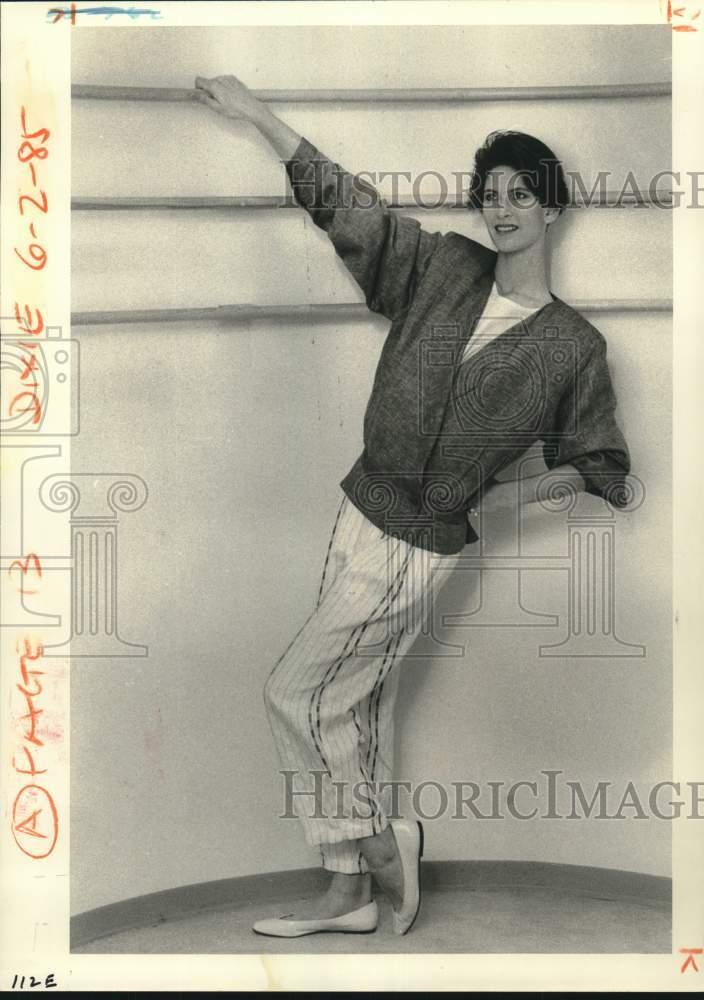 1985 A model wears blouson with pleats and pants by Andrew Fezza - Historic Images